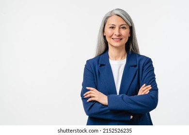 Happy confident smiling caucasian middle-aged mature businesswoman ceo manager employee in formal attire with arms crossed looking at camera isolated in white background.