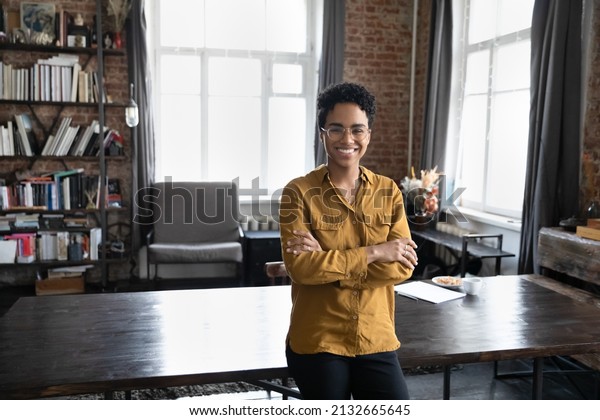 Happy confident young Black business woman,\
freelance professional, entrepreneur head shot portrait. Cheerful\
short haired female leader, employee posing in home office.\
Corporate head shot\
portrait