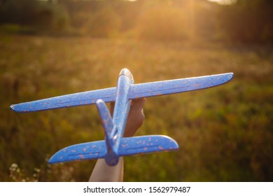 Happy Confident Young Kid Playing Outdoor In Summer Sunny Sunset Landscape. Setting Goals And Aims Concept. Horizontal Color Photography.