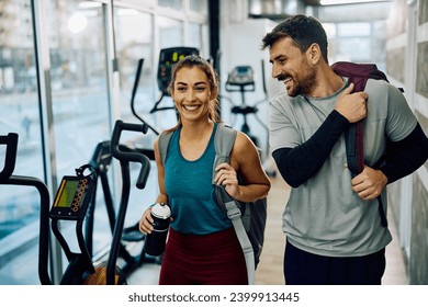 Happy couple of athletes coming to sports training in health club. Copy space.  - Powered by Shutterstock