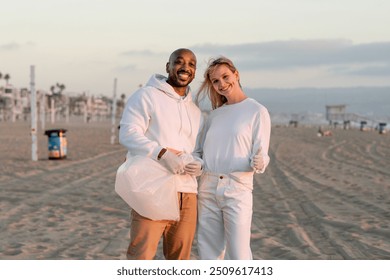 Happy couple beach cleaning volunteers, save the earth  nature - Powered by Shutterstock