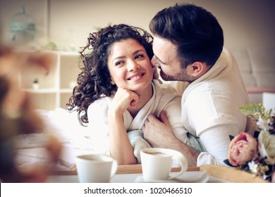 Happy couple in bed, morning time.  - Powered by Shutterstock