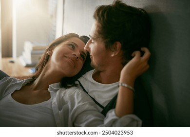 Happy couple, bedroom and bonding with relax, comfort and rest in home on weekend as romantic partner. People, love and affection for positive, care or intimacy in apartment or house as cute together - Powered by Shutterstock