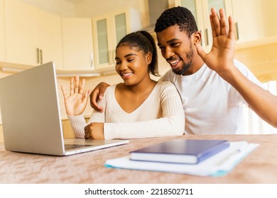 Happy Couple Calling By Video Chat To Family From Their New Apartment