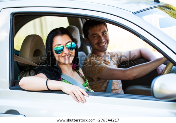 Happy couple in the\
car