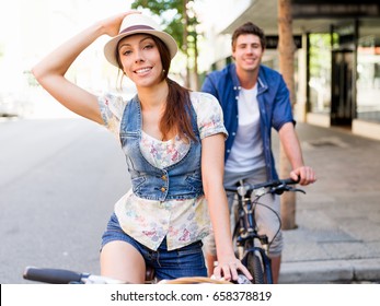 Happy Couple In City With Bike