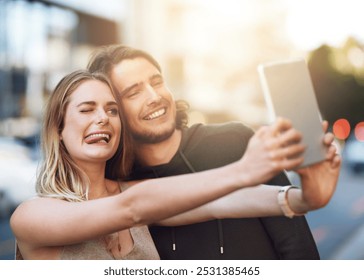 Happy couple, city or funny selfie with tablet for photography, picture or memory together. Young, man or woman with tongue out, silly or goofy face for moment, capture or technology in an urban town - Powered by Shutterstock