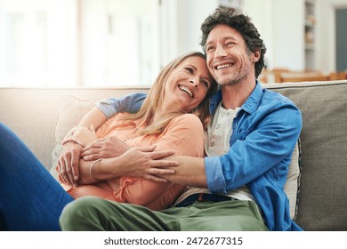 Happy couple, couch and hug in home with love, marriage and romance for man and woman in living room. Sofa, smile or support or solidarity for relationship, relax or trust for commitment and embrace - Powered by Shutterstock