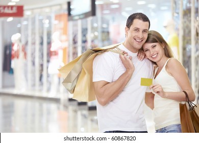 The Happy Couple With A Credit Card And Shopping At The Store