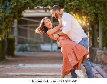 Happy couple, dance and love in park, garden and sunshine for bonding, quality time and romantic date together. Smile, dancing and fun man, woman and partner, freedom and happiness outdoors in summer - Powered by Shutterstock