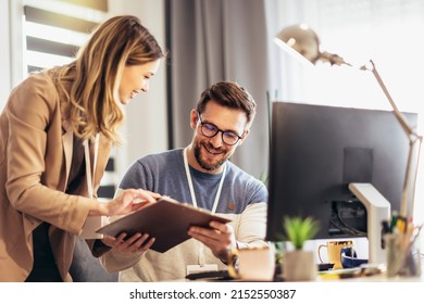 Happy Couple Doing Business Together Working At Small Office