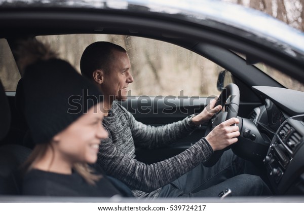Happy\
Couple Driving a car. Freedom of the open\
road.