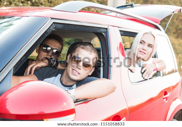 Happy couple driving on a car. Concept about\
transportation and love