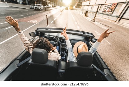 Happy Couple Driving On City Street In Convertible Car - Friends Rent Cabrio Auto On Vacation - Roadtrip, Freedom, Travel And Transport Rental Service Concept