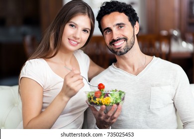 Happy Couple Eating A Healthy Salad