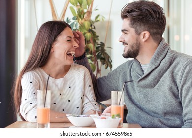 Happy couple eating salad for lunch at cafe.Love,date,people and relations concept. - Shutterstock ID 674559865