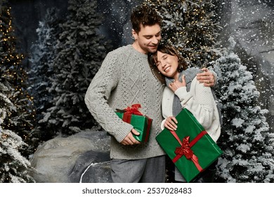 A happy couple embraces warmly near snow-covered fir trees, celebrating the holiday spirit together. - Powered by Shutterstock