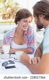 Happy Couple Enjoying Coffee Together Outside At The Coffee Shop