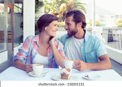 Happy Couple Enjoying Coffee Together Outside At The Coffee Shop