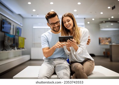 Happy couple enjoying social media content in a smart phone. Communication, connection concept. - Shutterstock ID 2353743553