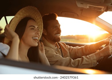 Happy couple enjoying trip together by car, selective focus - Powered by Shutterstock