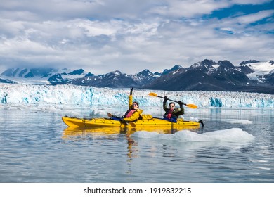 Happy couple enjoys ocean kayaking bear glacier during their vacation trip to in Alaska, USA  - Shutterstock ID 1919832215