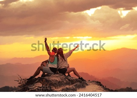 Similar – Image, Stock Photo Couple enjoys a sunset picnic on the rooftop