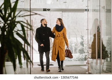 Happy Couple Entering At The Hotel Lobby From Outddors