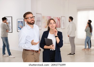 Happy Couple At Exhibition In Art Gallery