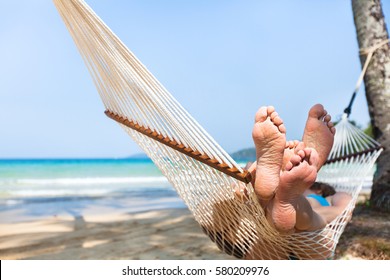 Happy Couple Family In Hammock On Tropical Paradise Beach, Island Holidays, Closeup Of Feet