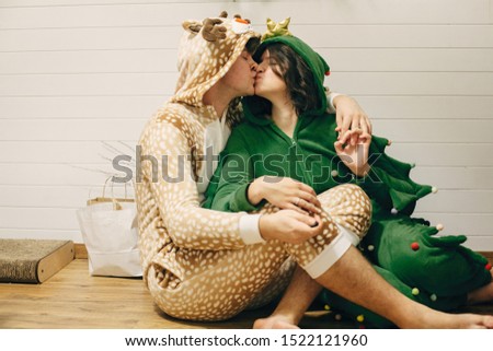 Similar – loving couple in the Park wearing pajamas