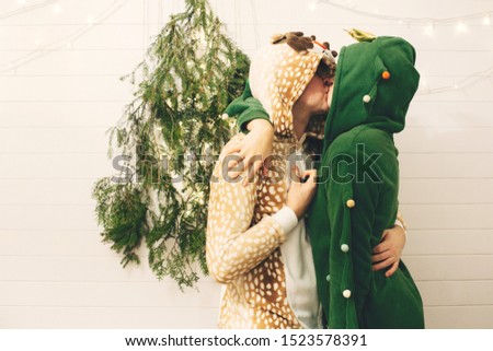 Similar – loving couple in the Park wearing pajamas