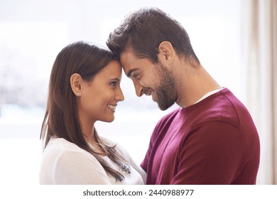 Happy couple, forehead and love with romance for affection, embrace or intimacy in support or care at home. Man and woman with smile in happiness, romantic relationship or bonding on holiday weekend - Powered by Shutterstock