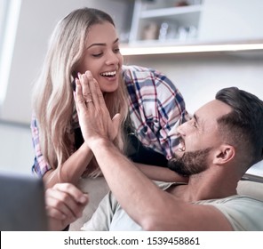 Happy Couple Giving Each Other A High Five