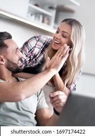 Happy Couple Giving Each Other A High Five