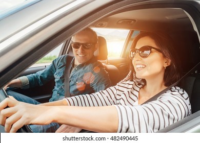 Happy couple goes by the car - Shutterstock ID 482490445
