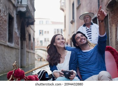 Happy Couple In Gondola On Canal In Venice