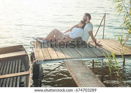 Happy couple have fun outdoor in the park / Happy couple have fun outdoor on the lake