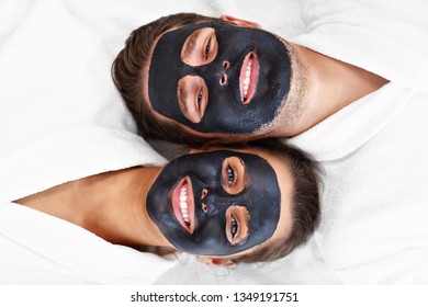 Happy couple having facial in spa salon - Powered by Shutterstock