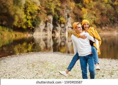 Happy couple having first date at nature. Fashion, people, lifestylea and autumn. Boyfriend with girlfriend having fun together outdoors. Fashionable couple in autumn. Love - Powered by Shutterstock