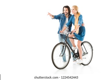 Happy Couple Having Fun While Woman Riding Bicycle Isolated On White