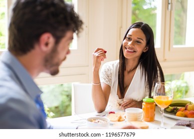 Happy Couple Having Healthy Breakfast At Home In The Morning - Happy Moments Of Domestic Partnership