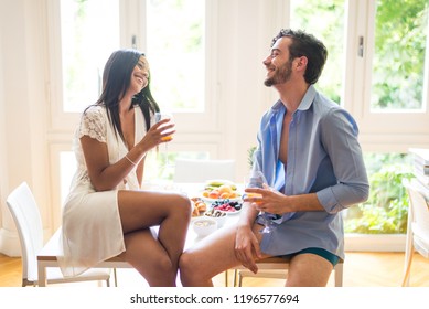 Happy Couple Having Healthy Breakfast At Home In The Morning - Happy Moments Of Domestic Partnership