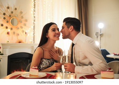 Happy couple having romantic dinner on Valentine's day in restaurant - Powered by Shutterstock