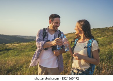 Happy couple is hiking in mountain. - Powered by Shutterstock