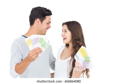 Happy Couple Holding Money On White Background