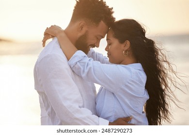 Happy couple, hug and beach with embrace for love, bonding or support in care on outdoor holiday. Young man, woman or lovers with smile in relax for sunset or weekend by sea or ocean coast in nature - Powered by Shutterstock