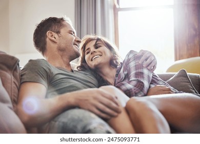 Happy, couple and hug on sofa with laughing at home for funny joke, humor and romance in relationship. Peace, man and woman with smile in living room for joy, comfort and bonding together on weekend - Powered by Shutterstock