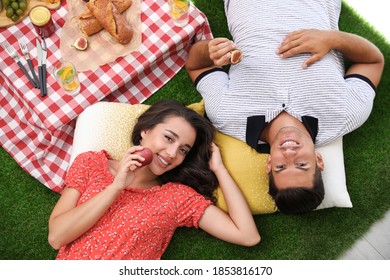 Happy Couple Imitating Picnic At Home, Top View