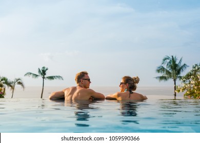 Happy Couple In Infinity Pool